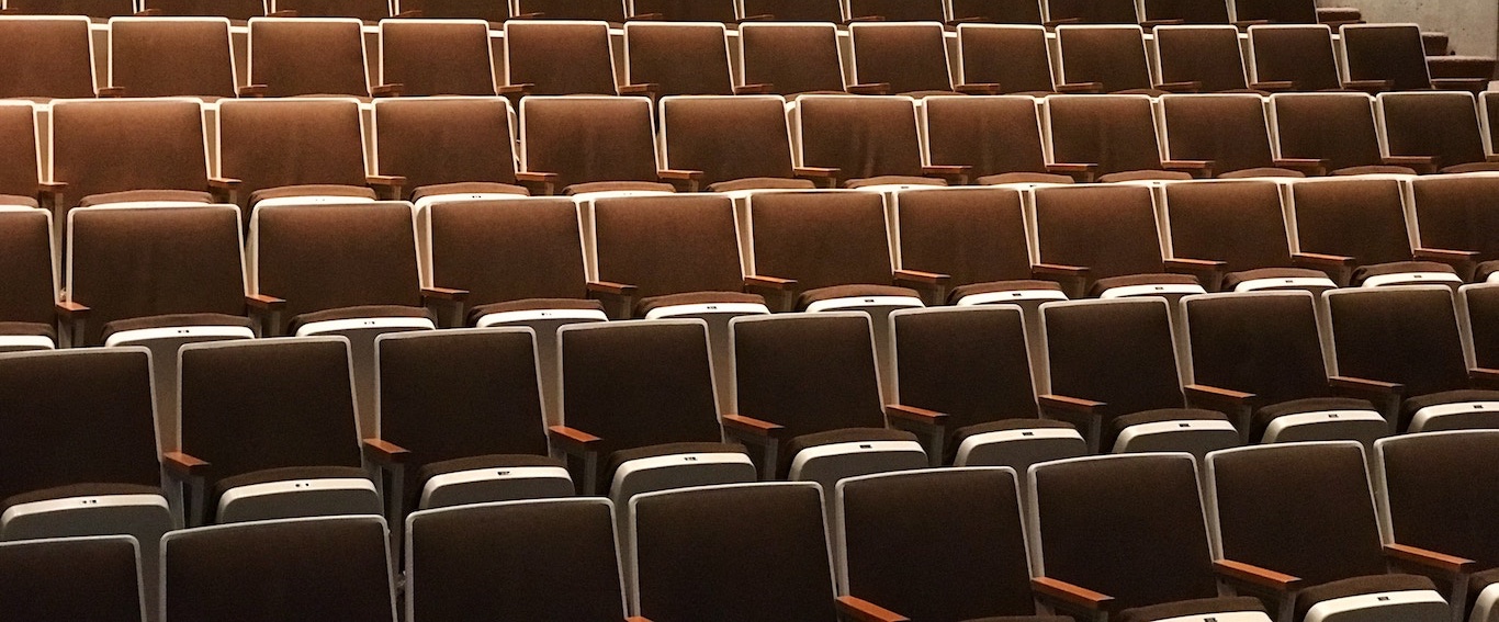 Photo of chair rows in a conference hall